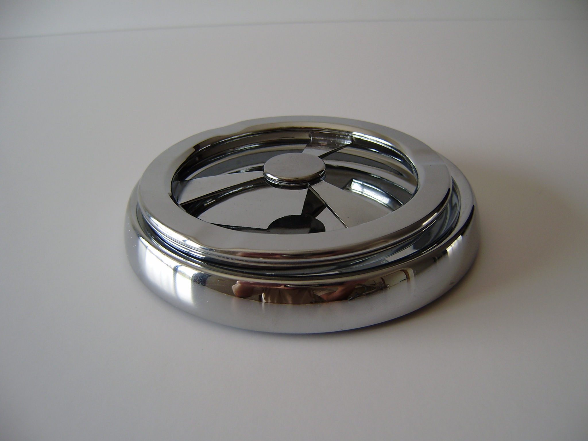 Polished circular product component photographed against a neutral background.